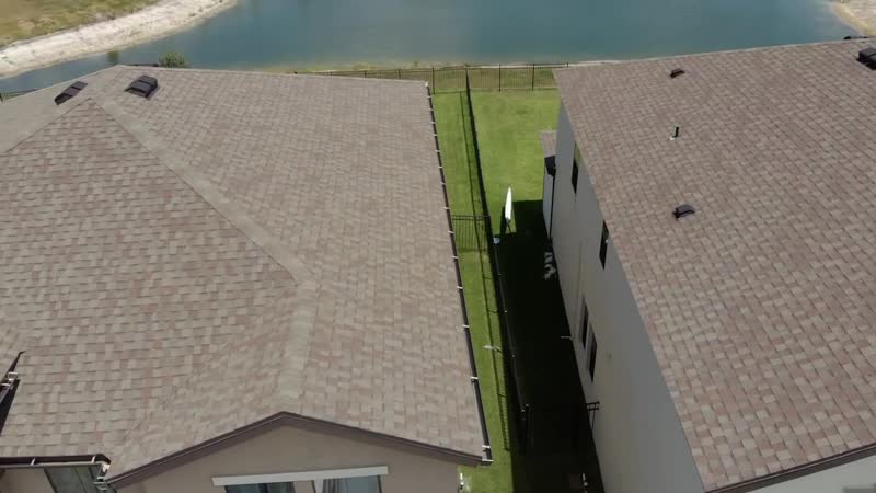 Aerial roof inspection on a waterfront Tampa Bay home